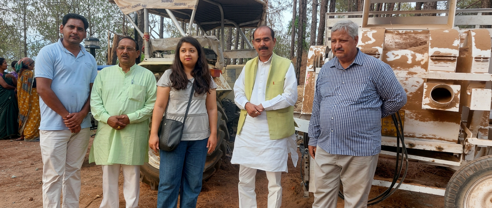 A group visiting pine needle processing equipment in the field